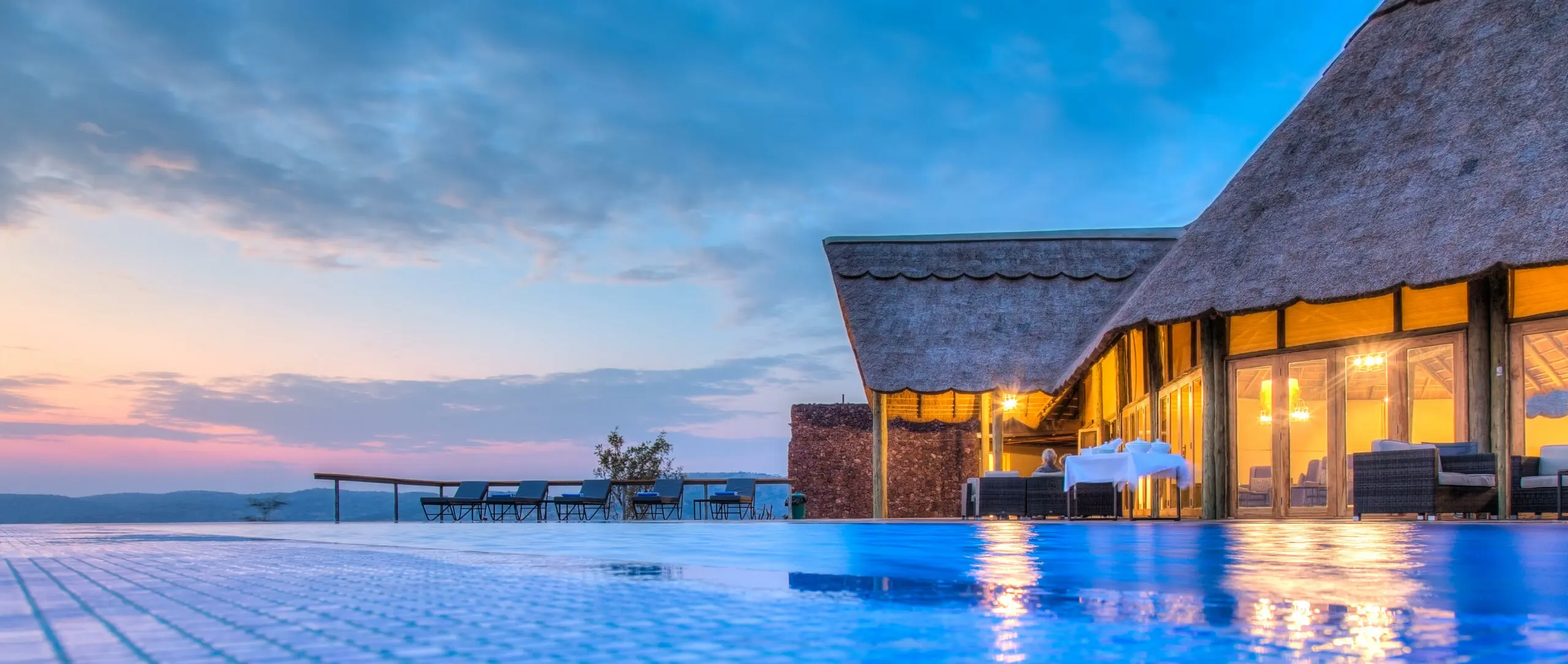 Honeymoon couple on safari in Tanzania at sunrise